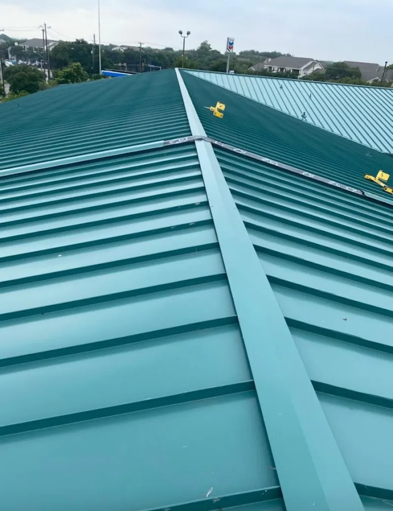 Green commercial metal roof ridge and valley for Metal Roof Repair in Coos Bay